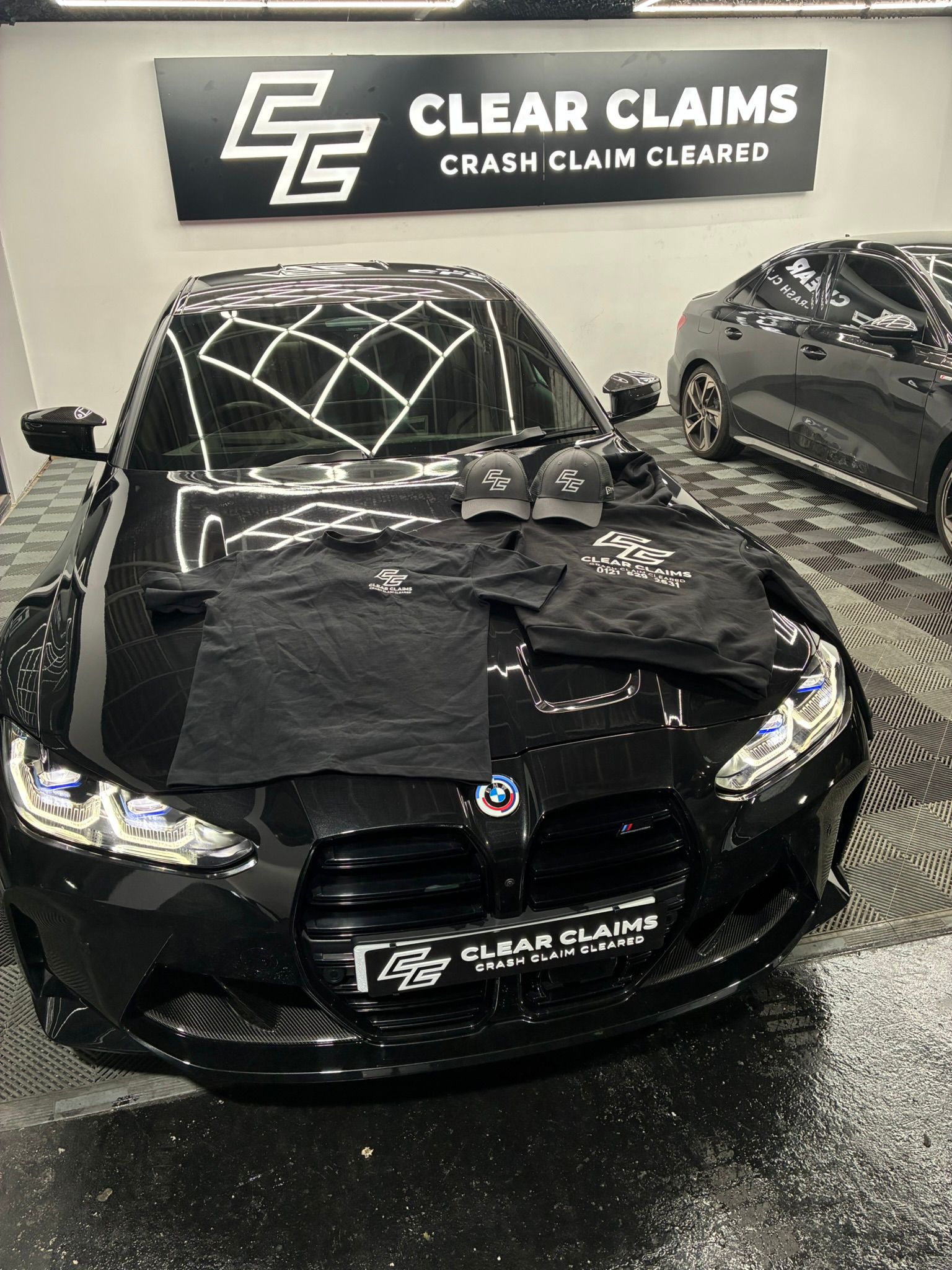 BMW M3 Competition with Clear Claims branded merchandise