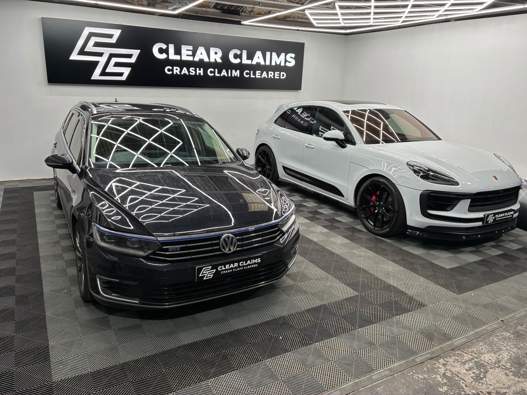 VW Passat and Porsche Macan GTS in Clear Claims studio